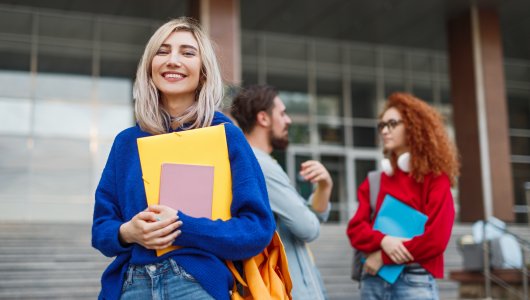 Cheerful young woman applying to university