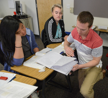 Teacher assisting students in class