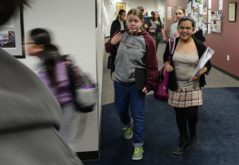 Students walking in school hallway