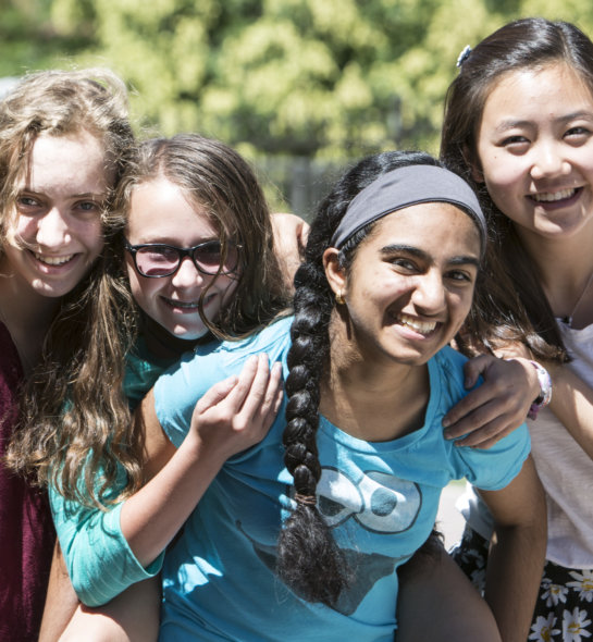 Students smiling outside