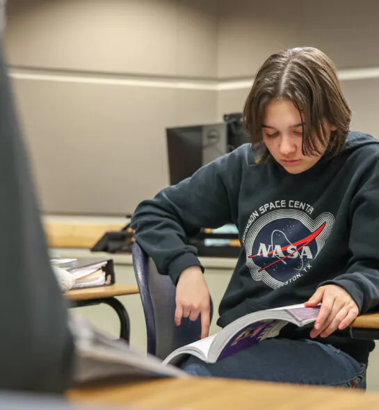 Girl reading a textbook