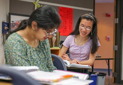 Two girls working on a class assignment together