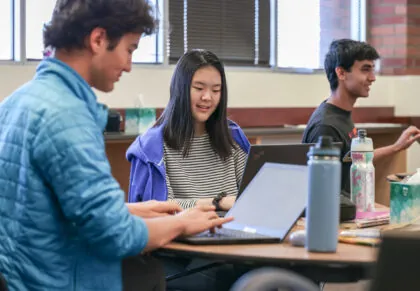 boy and girl working in a classroom together