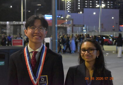 Students smiling with their medals