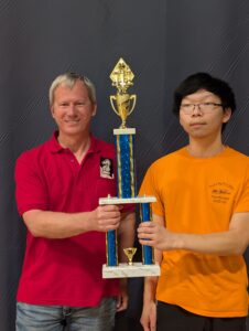 Ethan being awarded a championship trophy