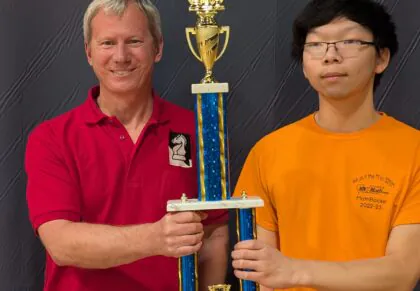 Ethan being awarded a championship trophy