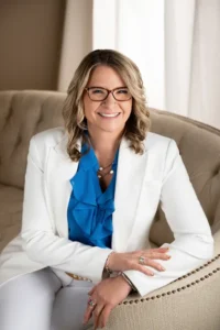 Woman smiling and sitting on couch